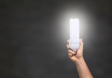 A hand holds an LED light.